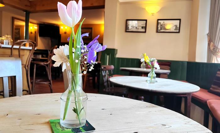 Fresh flowers in our cozy bar area